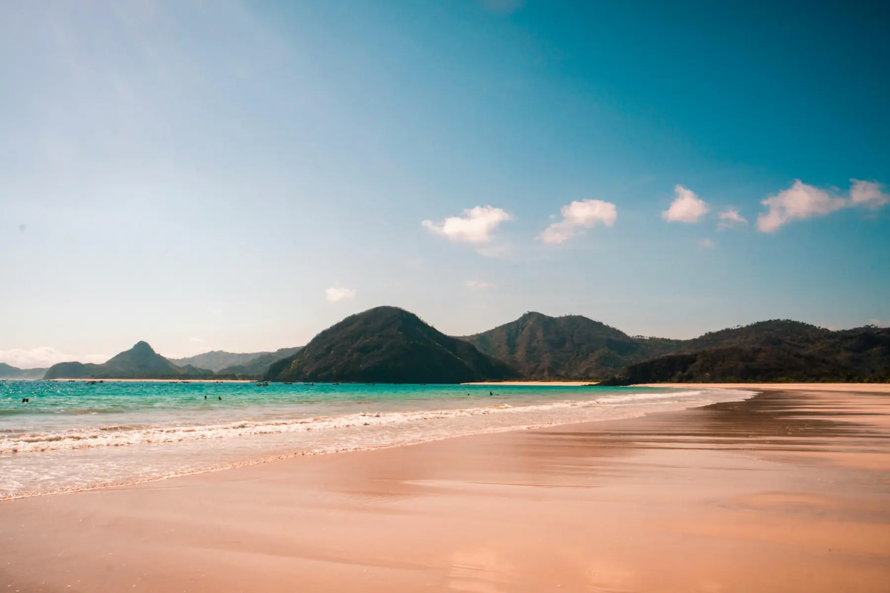 The sand and water at Selong Belanak beach